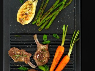 Lamb and carrots being grilled on the Electrolux plancha grill