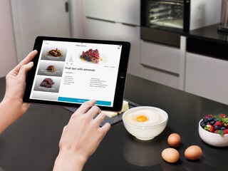 Selecting a recipe from the My Electrolux App on a tablet